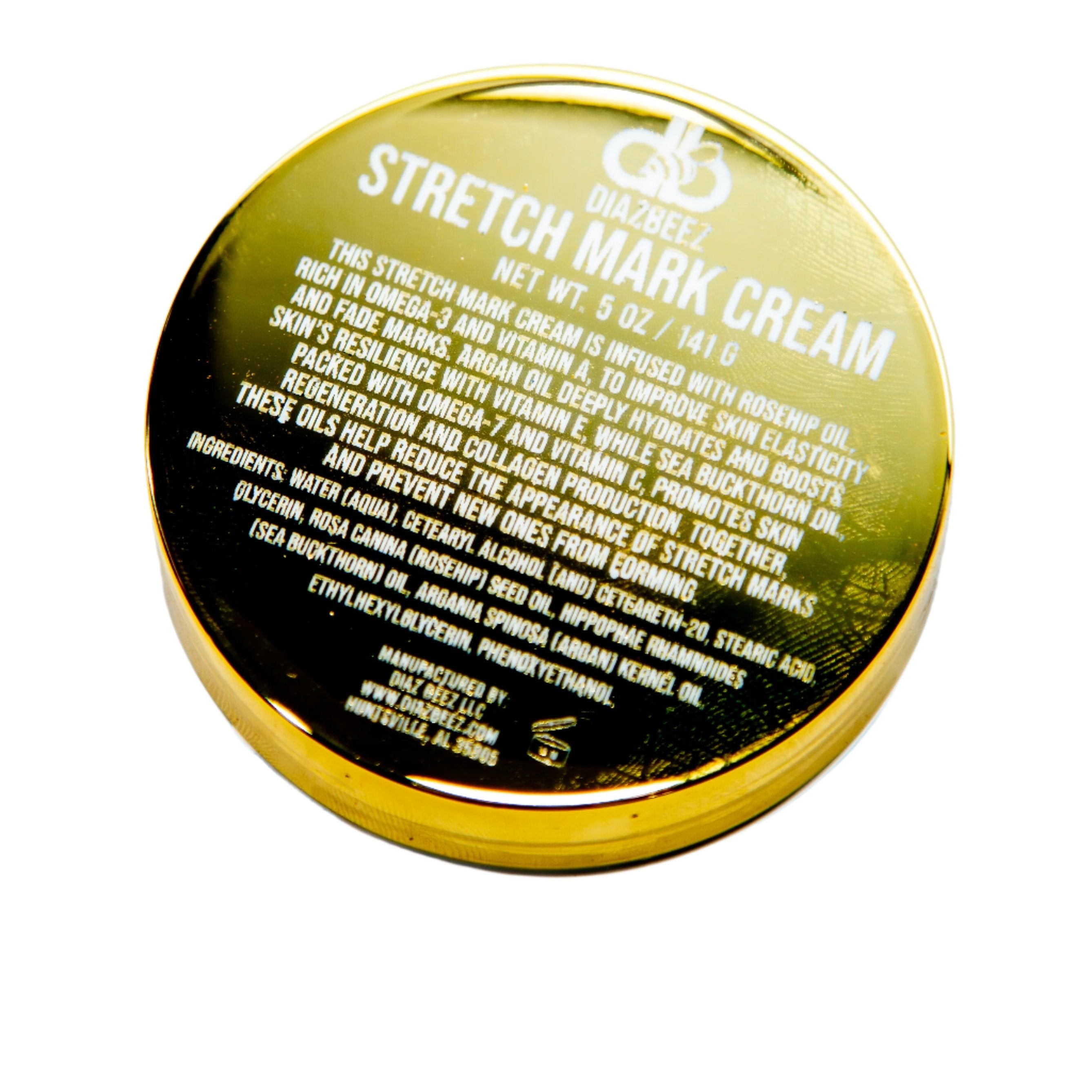 A round, gold container of Diaz Beez Stretch Mark Cream infused with Argan Oil includes a black label on the lid detailing ingredients and usage. The container has a net weight of 5 oz (141 g).