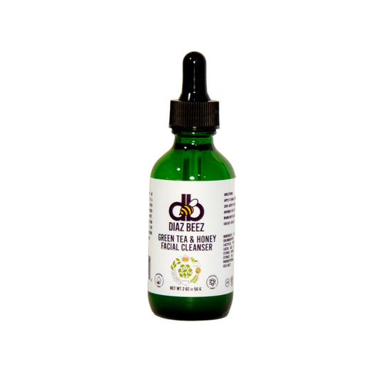 A green glass dropper bottle of Diaz Beez Green Tea & Honey Facial Cleanser against a plain white background. The label features the product name and a honeycomb logo at the top. The bottle size is indicated as 2 fl oz (60 ml).