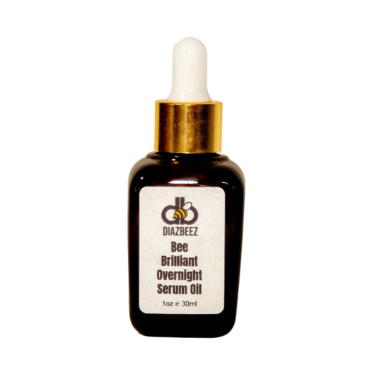 A dark glass bottle with a white dropper cap and gold collar contains a beauty product called "Bee Brilliant Overnight Serum" by Diaz Beez. This anti-aging face oil, labeled as 1 oz (30 ml), is designed for natural skin regeneration while you sleep.