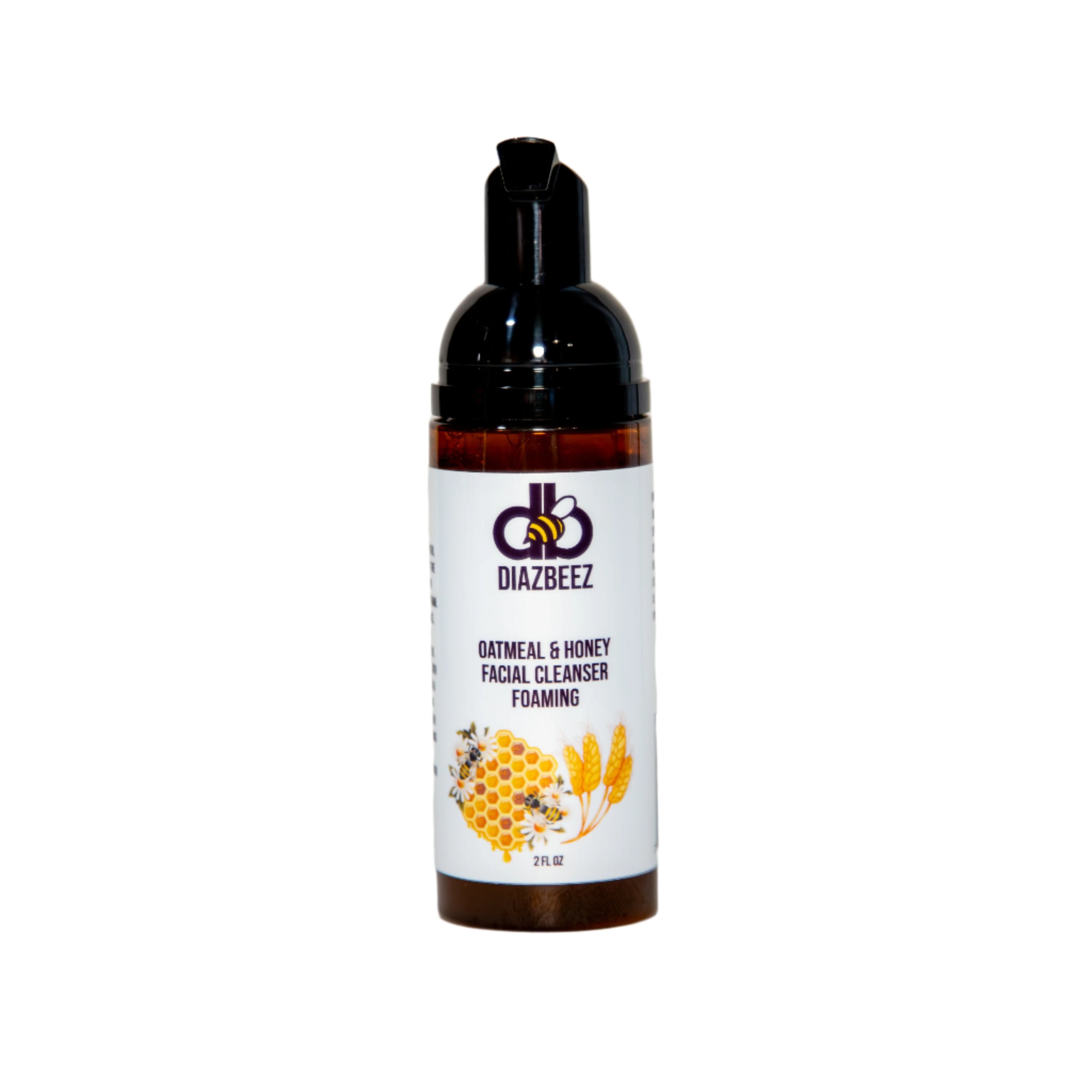 A bottle of Oatmeal & Honey Foaming Facial Cleanser by Diaz Beez features images of honeycomb and oats on the label, along with a black pump dispenser. The bottle is set against a plain white background.